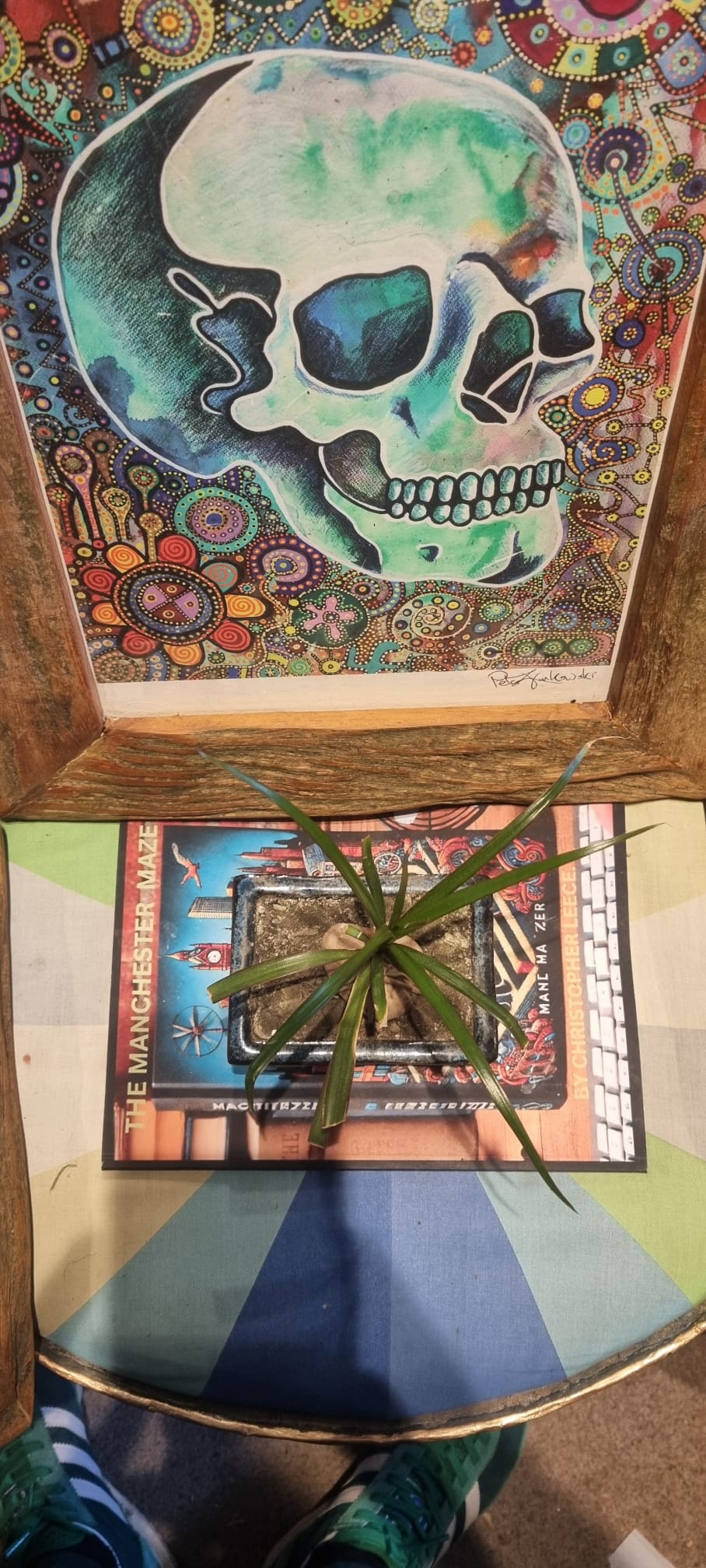 Skull artwork with dot work surround and The Manchester Maze book